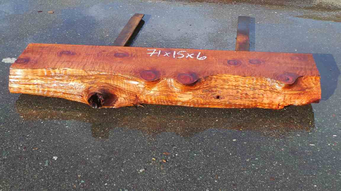 Rustic fireplace mantel with live edge and knots
