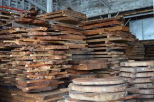 Salvaged redwood burl wood slabs and rounds for rustic wood furniture. 