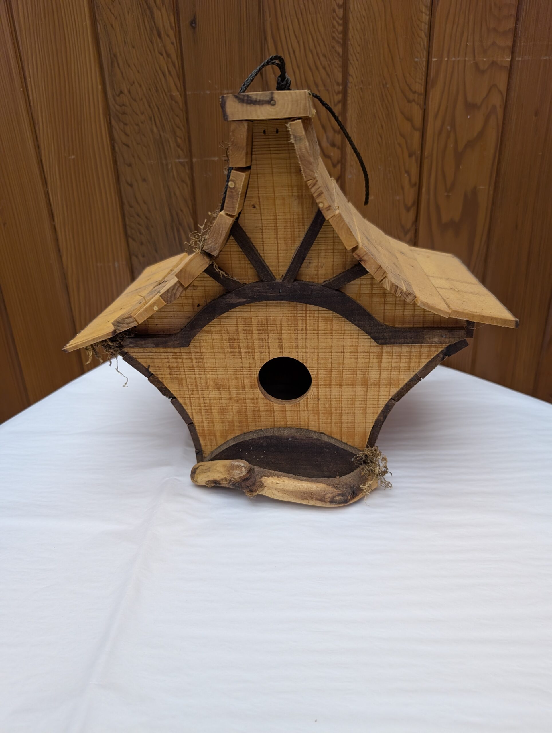 Pagoda-style, handcrafted bird house.