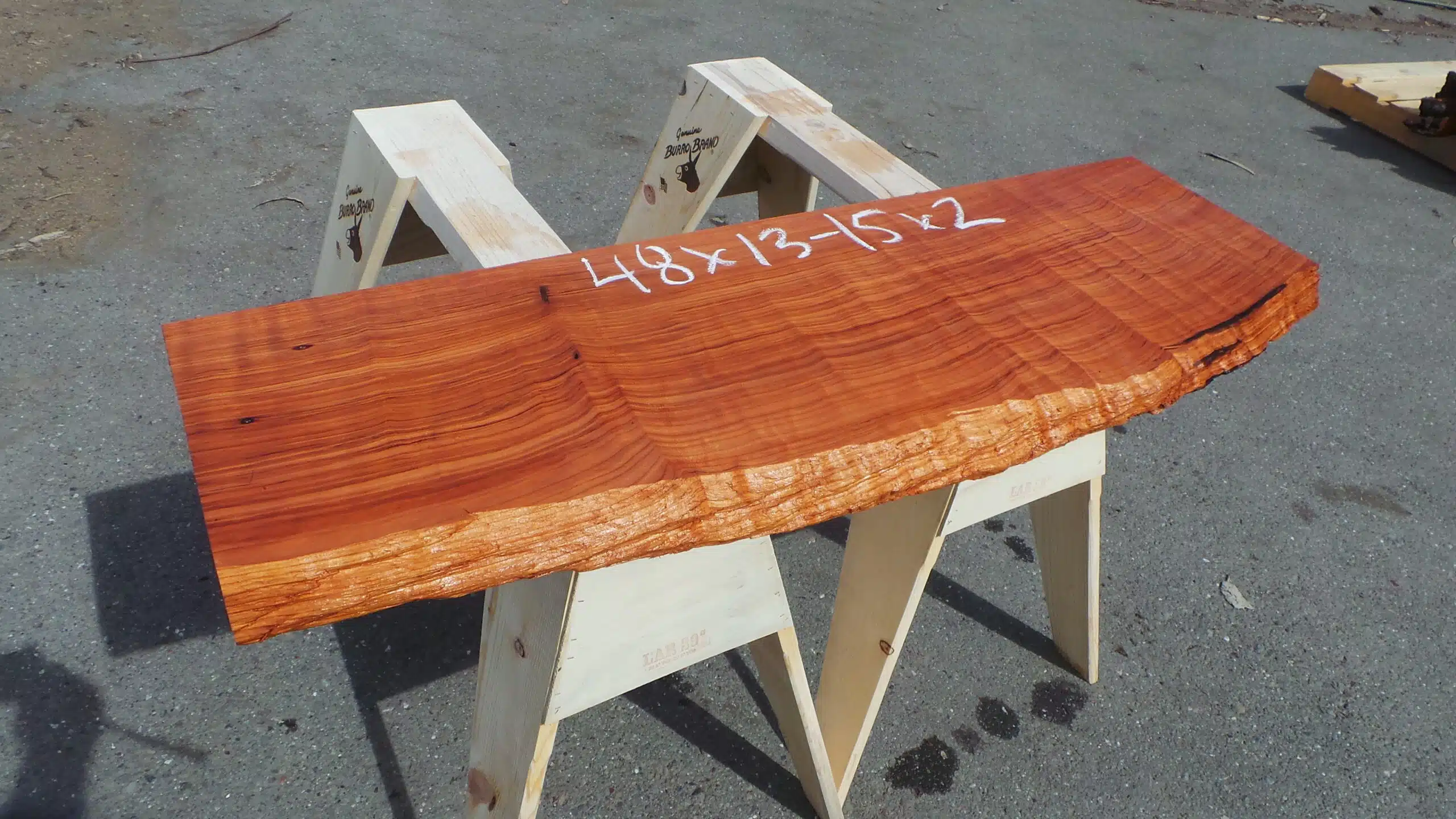 Old-growth redwood shelf or mantel with a live-edge.